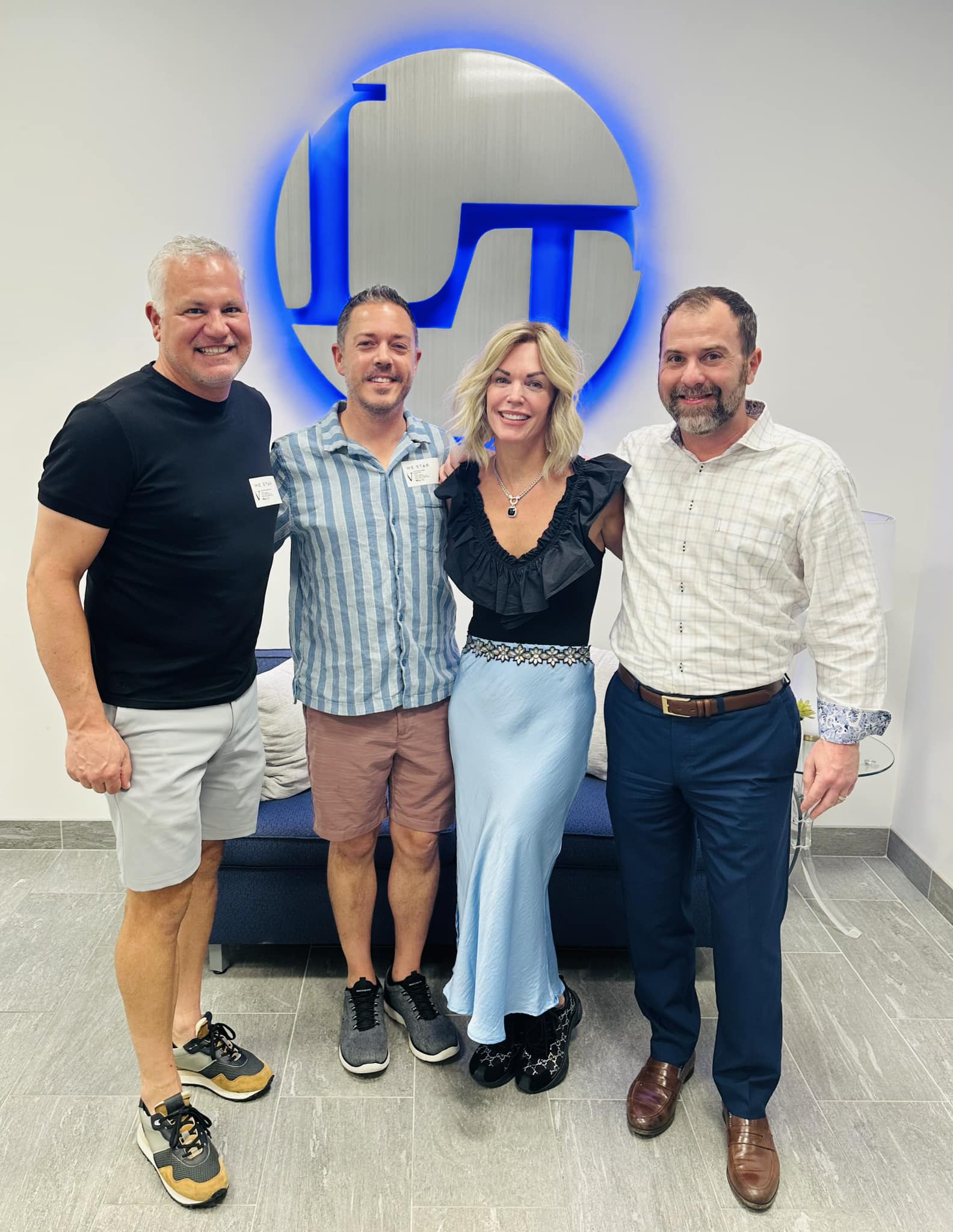 Andy Tuttle posing with Colleen Frost and one of their clients on closing day