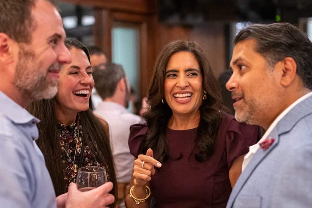 Andy and Beth Tuttle chatting with Nina and Che Bhanot